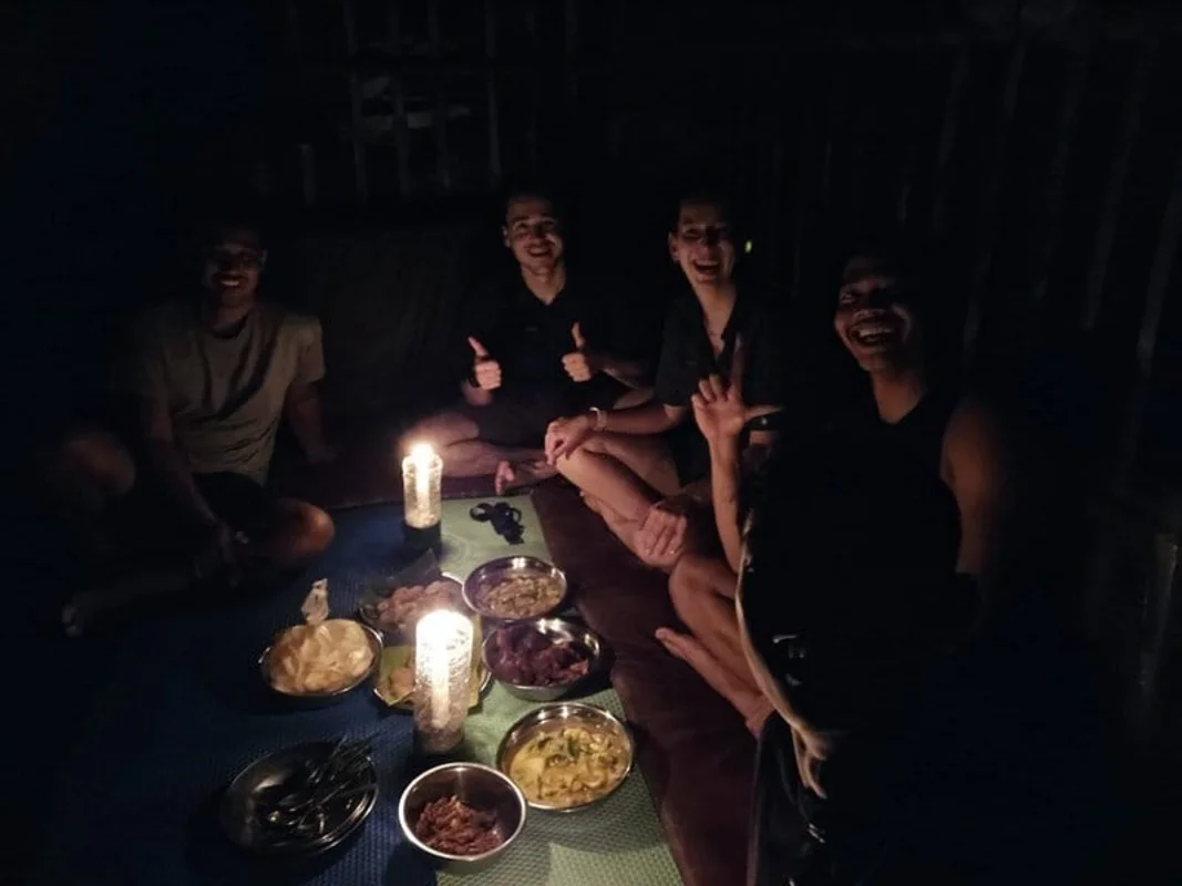 Jungle camp by river at night in Bukit Lawang